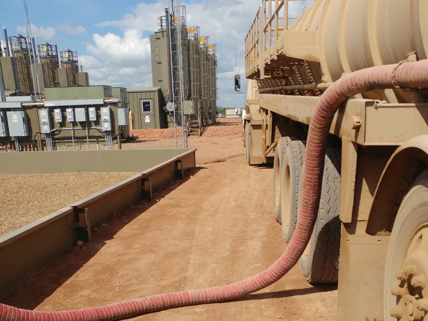 Vacuum truck working an oil lease
